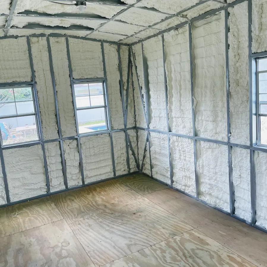 Closed-cell spray foam insulation applied to wall cavities in a residential project in Atlantic